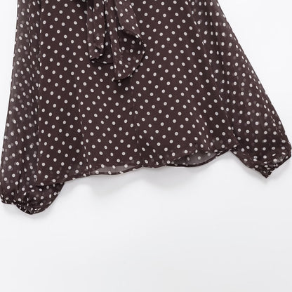 Woman wearing Bow Knot Polka Dot Long Sleeve Shirt in a casual setting