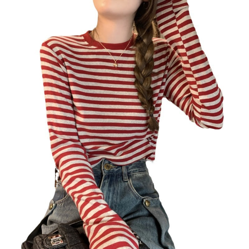 Woman wearing Stripe Long Sleeve Crop Top in a casual setting
