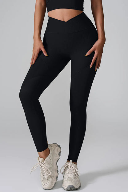 Woman wearing High Waist Active Leggings in a gym setting