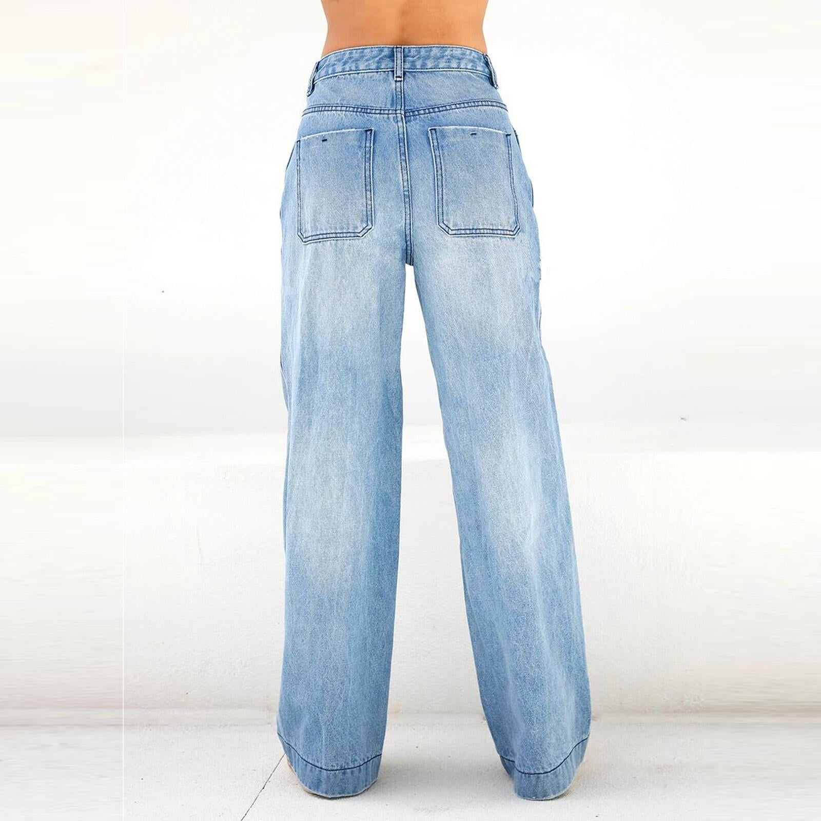 Woman wearing loose denim pants in a casual outdoor setting