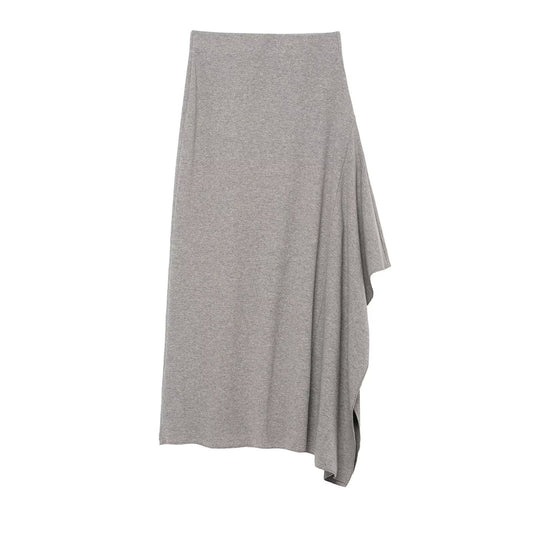 Woman wearing Asymmetric Pleated Midi Skirt in a stylish setting