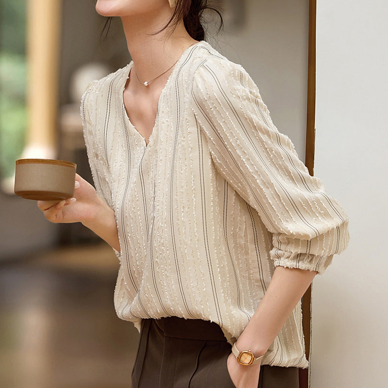 Woman wearing Elegant Textured Collar Shirt in urban setting