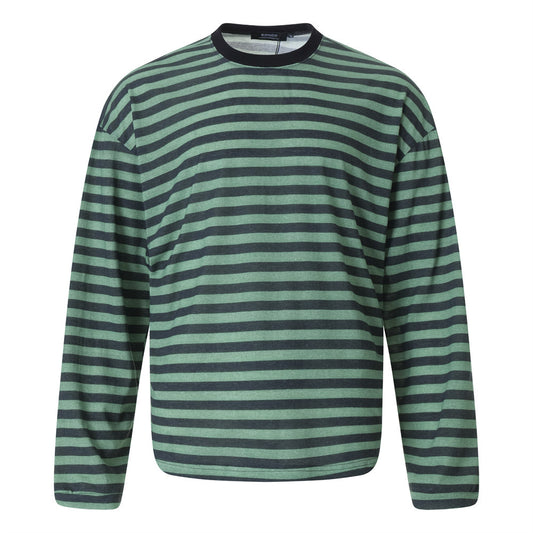 Woman wearing Loose Striped Round Neck Shirt in casual setting
