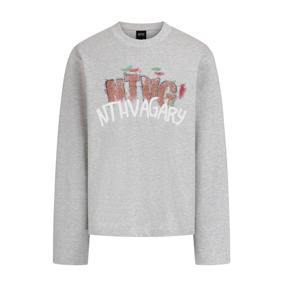 Woman wearing Hand Drawn Graffiti Letter Printed Long Sleeve Shirt in a casual setting