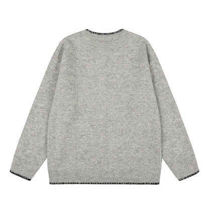 Woman wearing Hand-Stitched Loose Fit Knit Cardigan in a cozy setting
