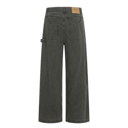 Woman wearing Distressed Black Denim Straight Leg Pants in an urban setting
