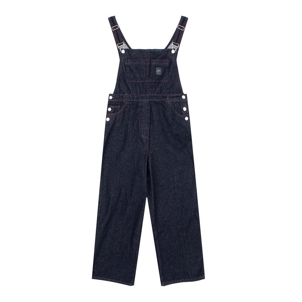 Woman wearing Distressed Denim Overalls in a casual outdoor setting