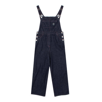 Woman wearing Distressed Denim Overalls in a casual outdoor setting