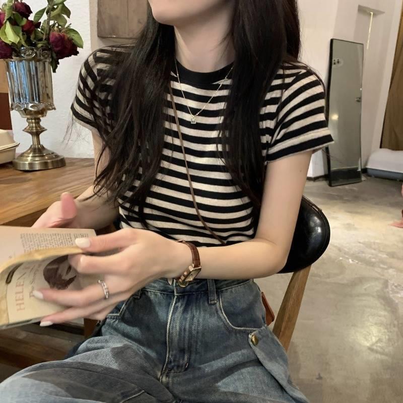 Woman wearing Striped Slim Fit T-Shirt in a casual setting