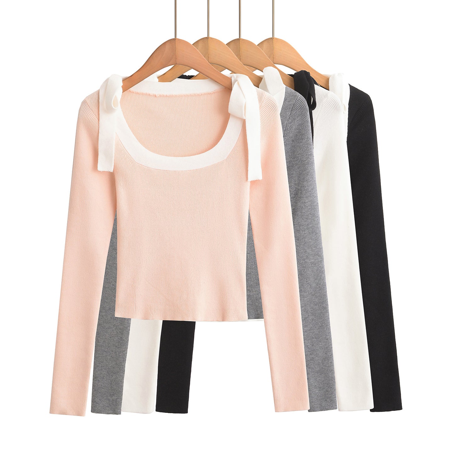 Woman wearing Square Neck Bow Ribbon Slim Fit Long Sleeve Sweater in a chic urban setting