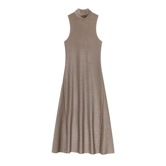 Woman wearing metallic sleeveless dress in a casual setting