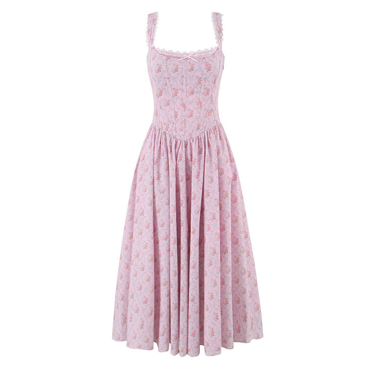 Woman wearing Lace Trimmed Printed Waist-Cinched Midi Dress in a garden setting