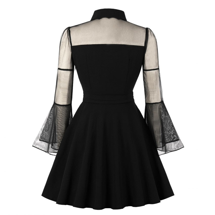 Woman wearing Gothic Mesh Patchwork Flare Sleeve Dress in a party setting