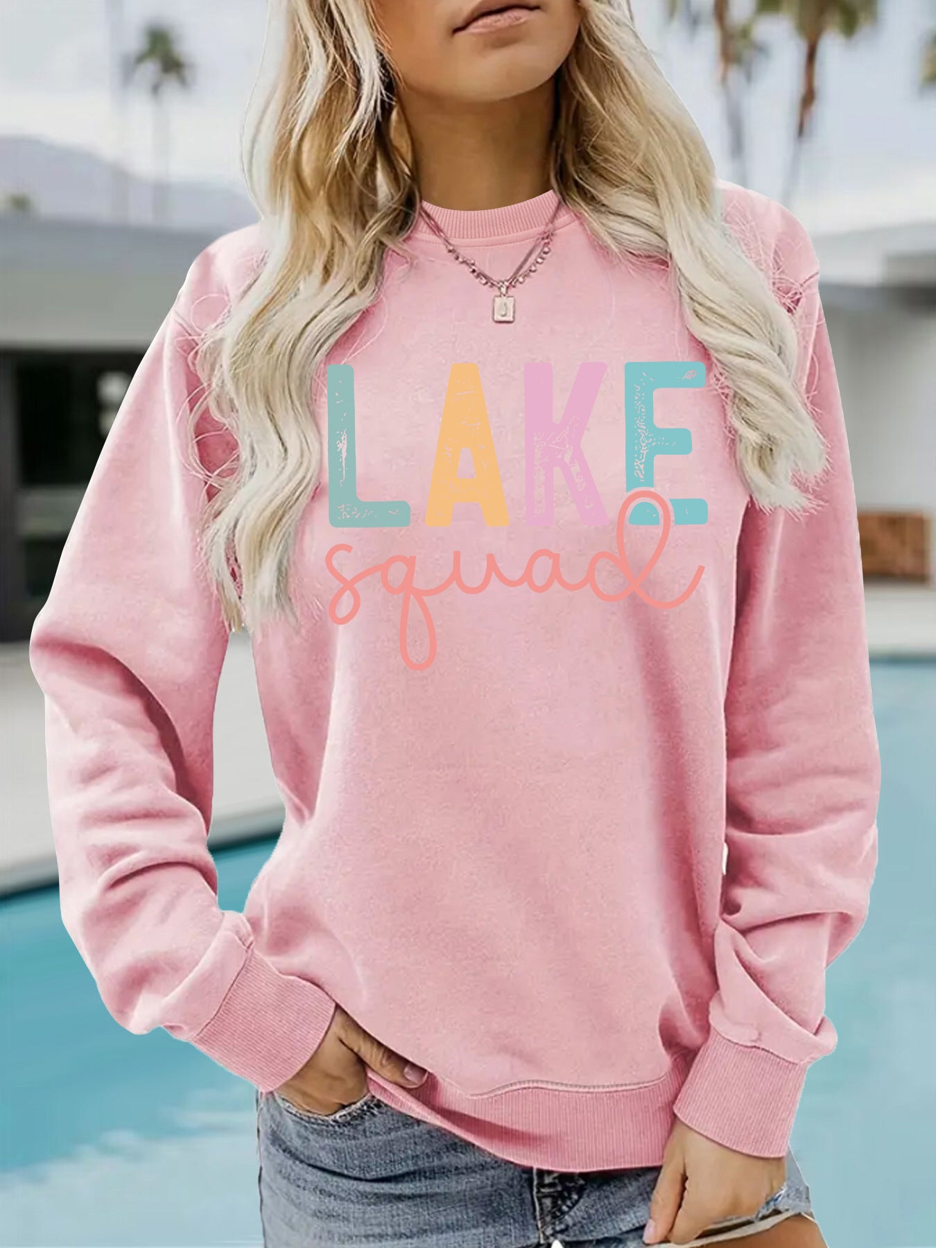 Woman wearing LAKE Printed Hoodie in a casual outdoor setting