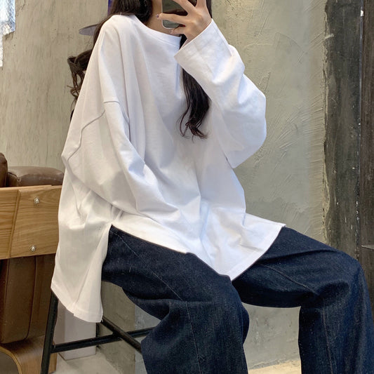 Woman wearing Split Color Long Sleeve T Shirt in a casual setting