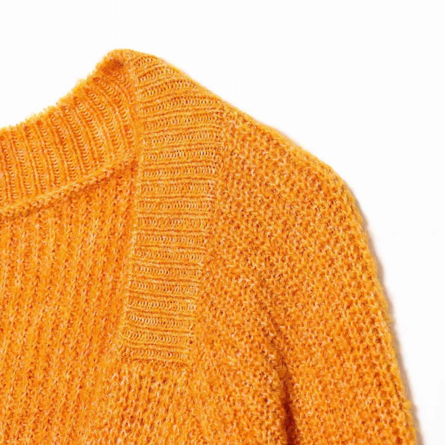 Woman wearing Back Knot Knit Sweater in a cozy setting