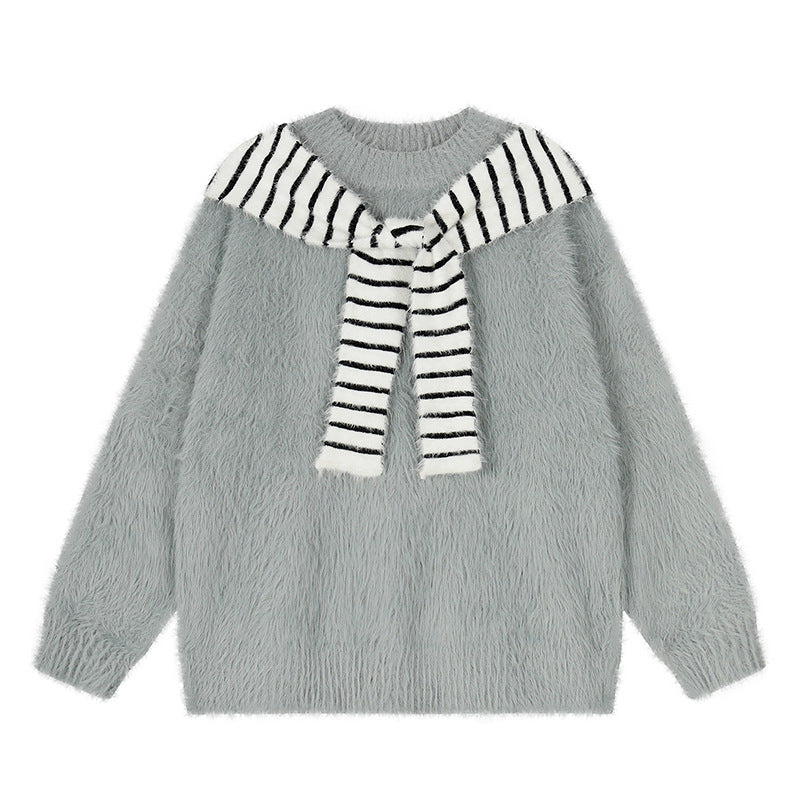 Woman wearing Oversized Loose Fit Poncho Knit Sweater in a cozy indoor setting