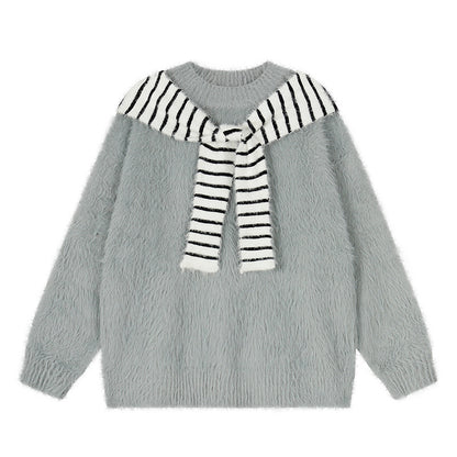 Woman wearing Oversized Loose Fit Poncho Knit Sweater in a cozy indoor setting