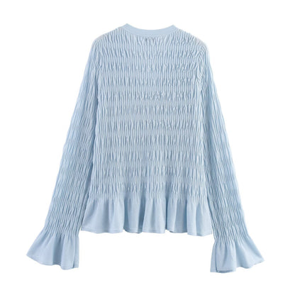 Woman wearing Light Blue Pleated Knitted Jacket in a casual setting