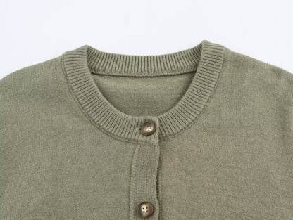 Woman wearing Round Neck Long Sleeved Knitted Cardigan Jacket in a stylish setting