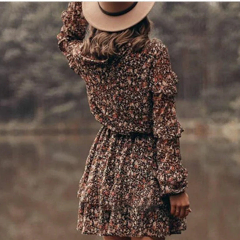 Woman wearing Floral Print Ruffle Sleeve Midi Dress in a garden setting