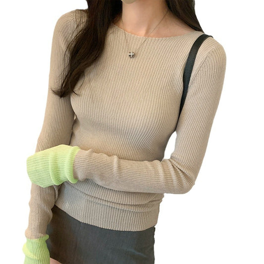 Woman wearing Colour Block Slim Fit Knit Sweater in a stylish urban setting
