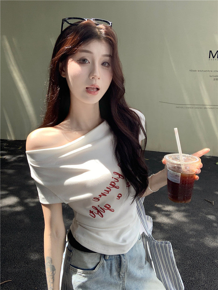 Woman wearing One Shoulder Fitted Crop Top in a casual setting