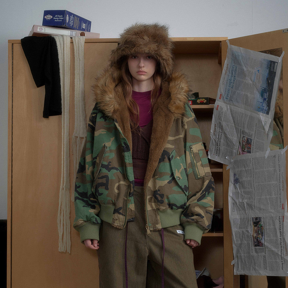 Woman wearing Camouflage Hooded Cotton Jacket in an urban setting
