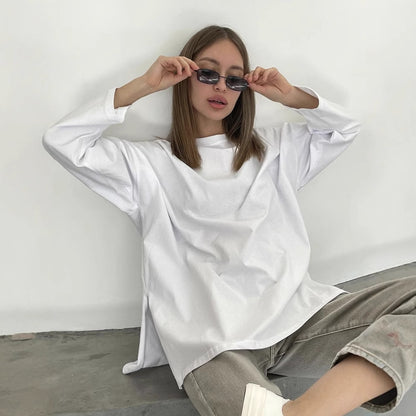 Woman wearing Loose Fit Long Sleeve Slit T-Shirt in a casual setting
