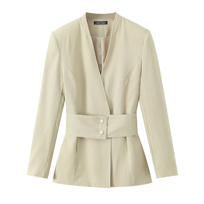 Woman wearing Tailored Waist Belt Suit Jacket and Pants Set in an office setting