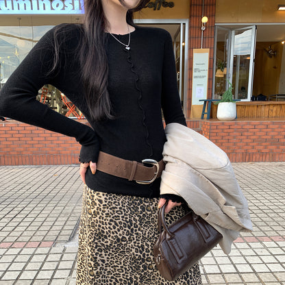 Woman wearing Lace Trim Round Neck Long Sleeve Knit Top in a stylish setting