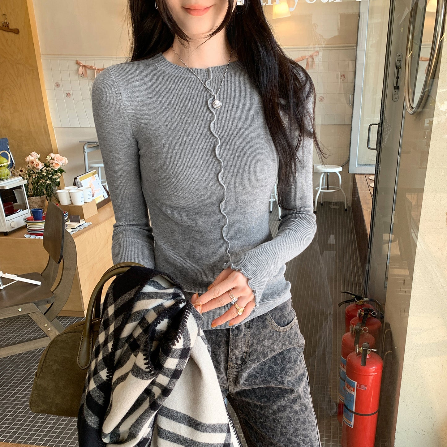 Woman wearing Lace Trim Round Neck Long Sleeve Knit Top in a stylish setting
