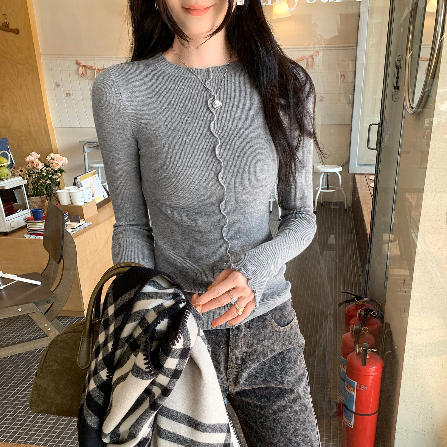Woman wearing Lace Trim Round Neck Long Sleeve Knit Top in a stylish setting