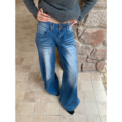 Woman wearing Wide Leg Flare Jeans in a casual outdoor setting