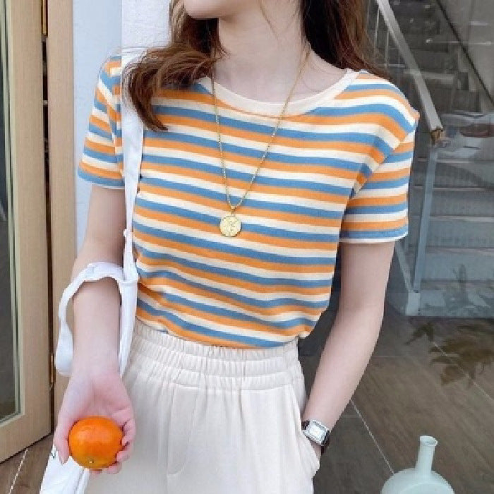 Woman wearing Women’s Stripe Short Sleeve Slim Fit Casual Top in a casual setting