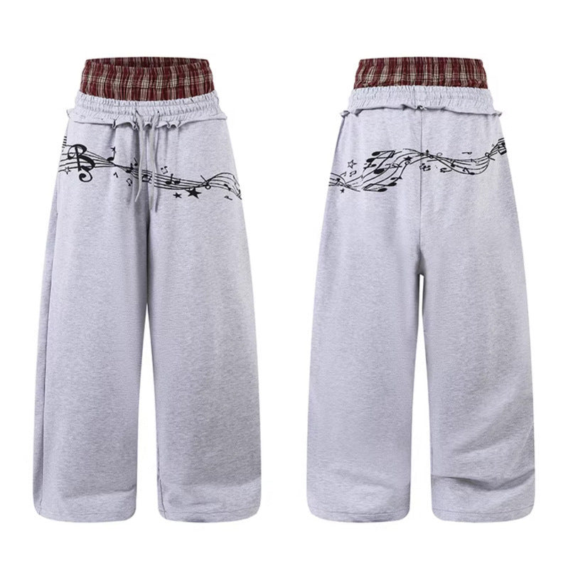 Woman wearing Double Waistband Music Note Graffiti Wide Leg Pants in a casual setting