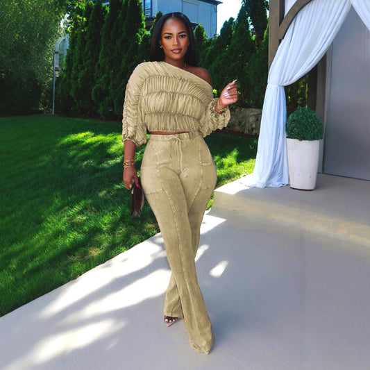 Woman wearing Flattering Two Piece Set with Crop Top and Flared Pants in a stylish urban setting