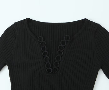 Woman wearing V-Neck Hollowed Out Slim Fit Top in a stylish setting