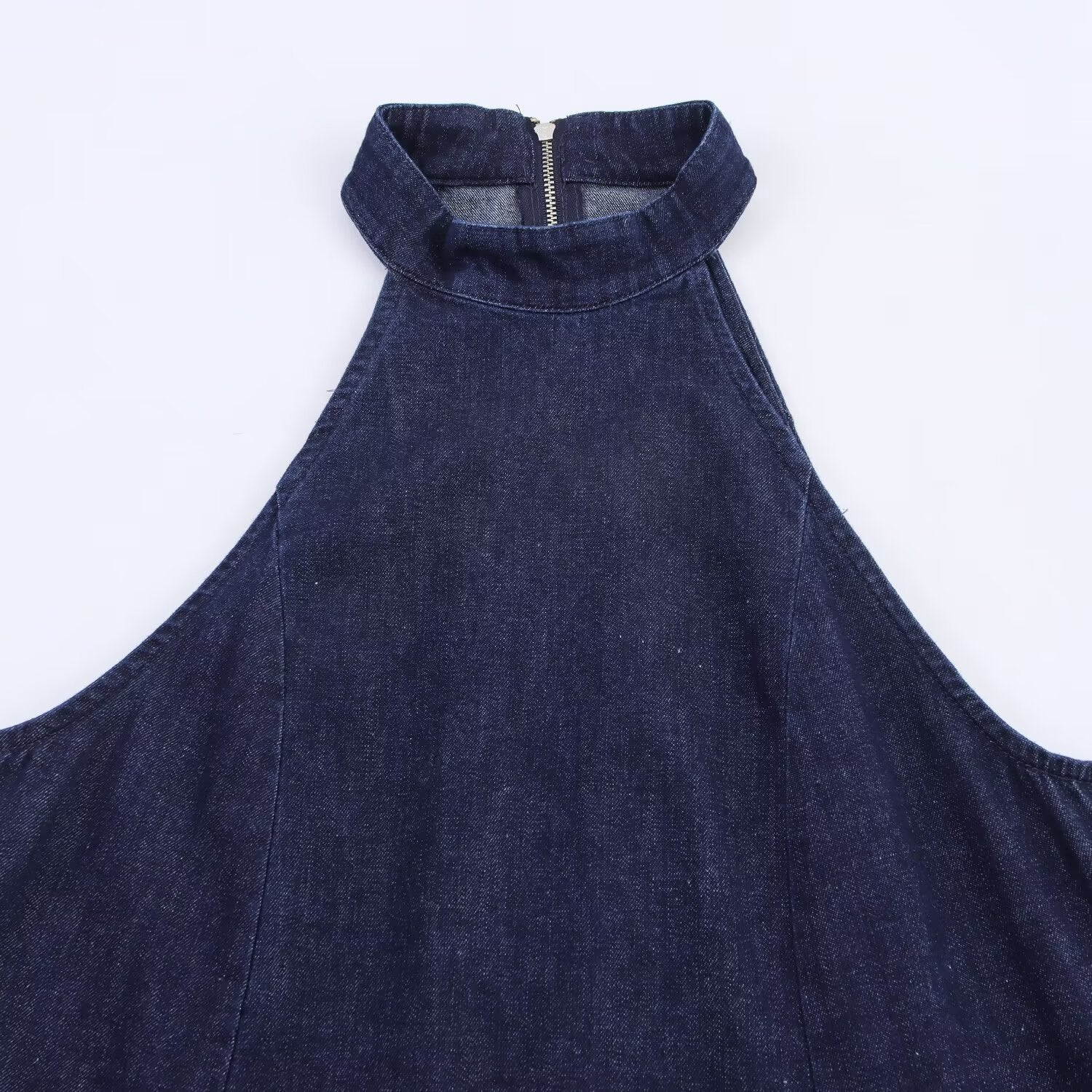 Woman wearing Halter Neck Denim Dress in a casual outdoor setting