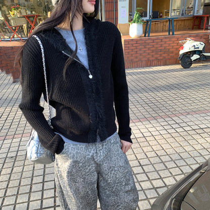 Woman wearing Hooded Knit Cardigan with Fur Collar in a cozy setting