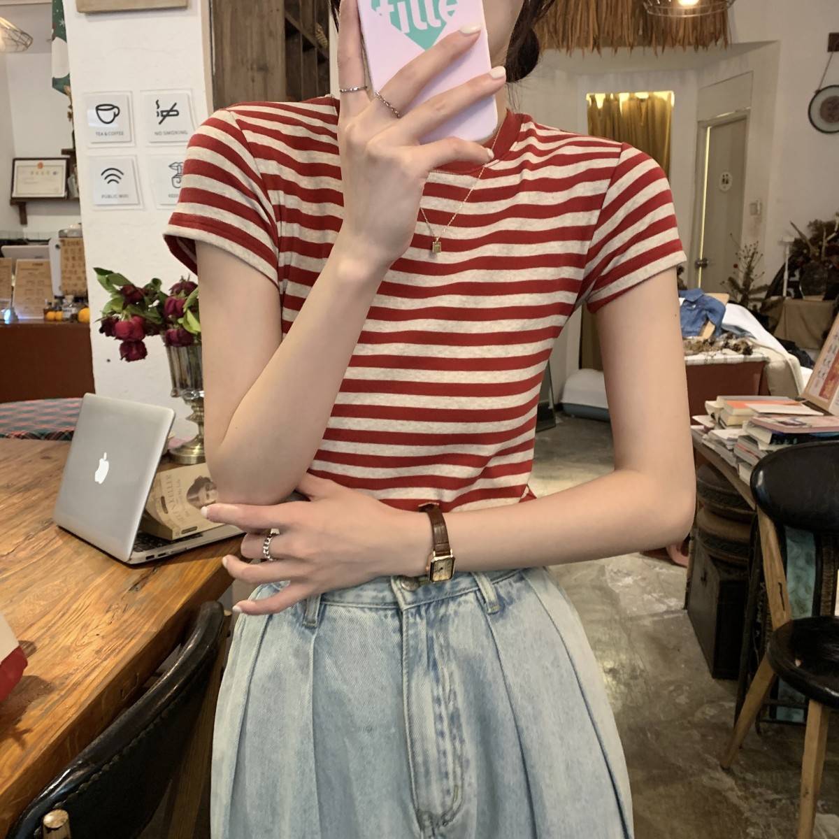 Woman wearing Striped Slim Fit T-Shirt in a casual setting