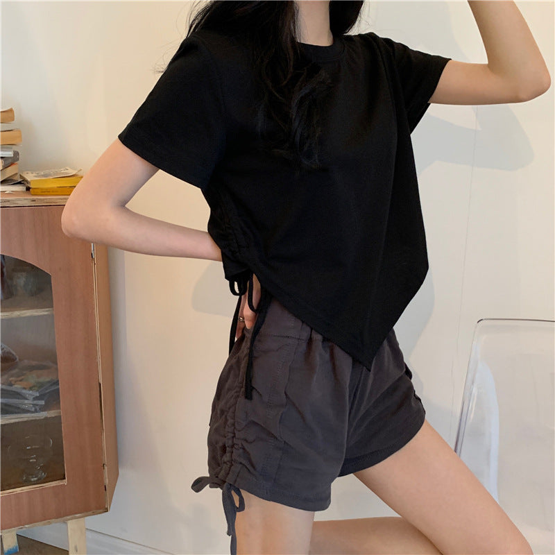 Woman wearing Irregular Drawstring Cropped T-Shirt in a city setting