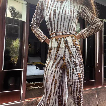 Woman wearing Burnout Print Slim Fit High-Waist Trousers in a chic urban setting