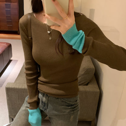 Woman wearing Colour Block Slim Fit Knit Sweater in a stylish urban setting