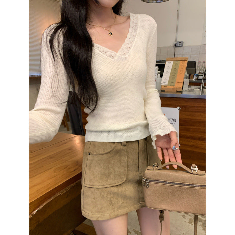 Woman wearing Slim Fit V-Neck Knit Top in a casual setting