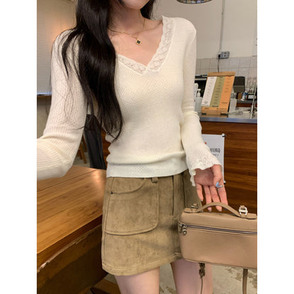 Woman wearing Slim Fit V-Neck Knit Top in a casual setting