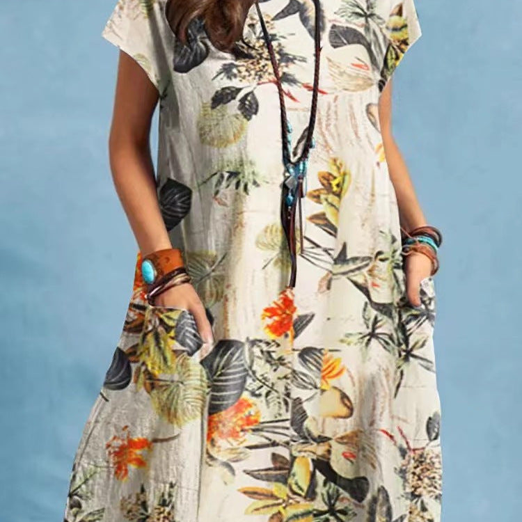 Woman wearing Floral A-Line Cap Sleeve Dress in a garden setting