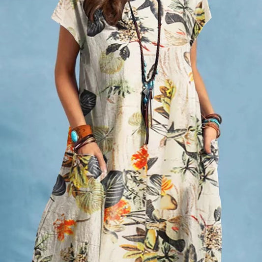 Woman wearing Floral A-Line Cap Sleeve Dress in a garden setting