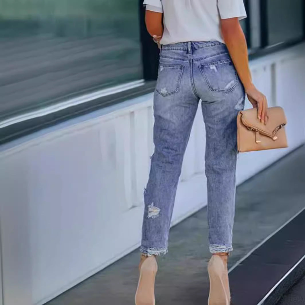 Woman wearing Ripped Mid Waist Jeans in a casual outdoor setting