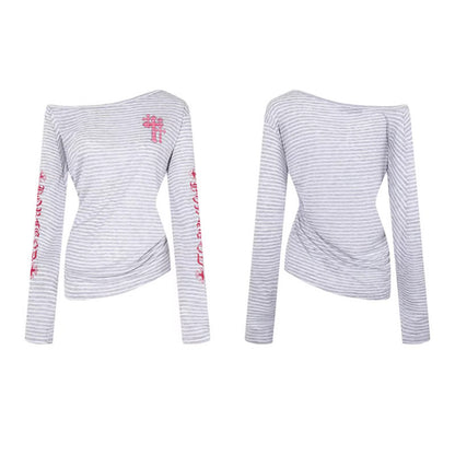 Woman wearing Stripe Graffiti Off Shoulder Long Sleeve Tee in an urban setting